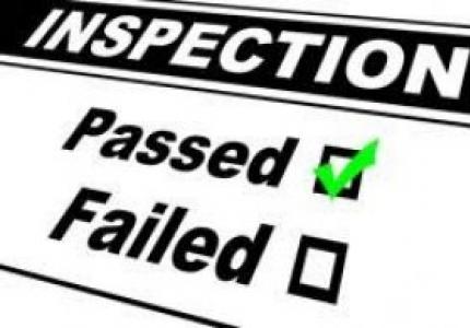 The title Inspection with the words passed and failed under it and a green checkmark in the checkbox next to Passed