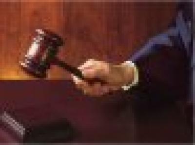Image of a judges hand holding a gavel.