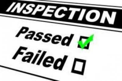 The title Inspection with the words passed and failed under it and a green checkmark in the checkbox next to Passed